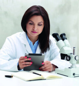 Professional, doctor. Scientist with microscope